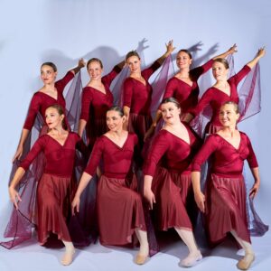 Adult Ballerinas In Red Dresses
