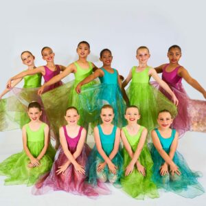 Young Ballerinas in Green, Blue & Purple Dresses