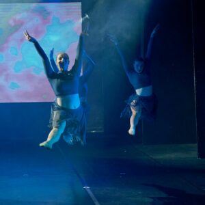 Ballerinas in Black Costume Performing On Stage