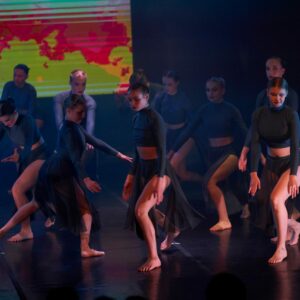 Ballerinas in Black Costume Performing On Stage