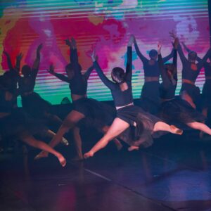 Ballerinas in Black Costume Performing On Stage