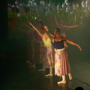 Teenage Ballerinas in Flower Dresses Performing On Stage