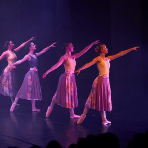 Teenage Ballerinas in Flower Dresses Performing On Stage