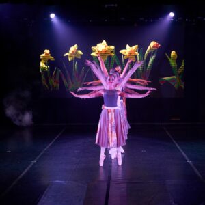 Teenage Ballerinas in Flower Dresses Performing On Stage