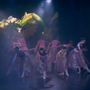 Teenage Ballerinas in Flower Dresses Performing On Stage