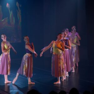 Teenage Ballerinas in Flower Dresses Performing On Stage