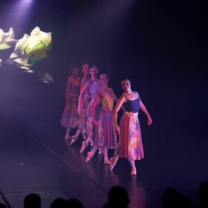 Teenage Ballerinas in Flower Dresses Performing On Stage