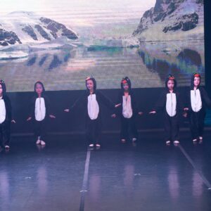Ballerinas in Penguin Costumes Performing On Stage