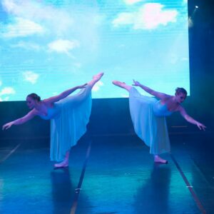 Teenage Ballerinas in Blue Dresses Performing On Stage
