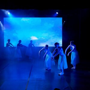 Teenage Ballerinas in Blue Dresses Performing On Stage