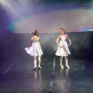 Young Ballerinas in White Dress Performing On Stage