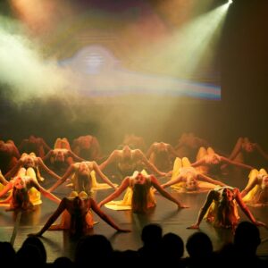 Teenage Ballerinas in Yellow Dresses Performing On Stage