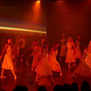 Teenage Ballerinas in Yellow Dresses Performing On Stage