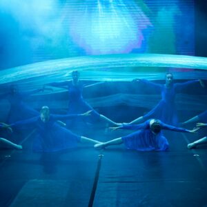 Teenage Ballerinas in Blue Dresses Performing On Stage